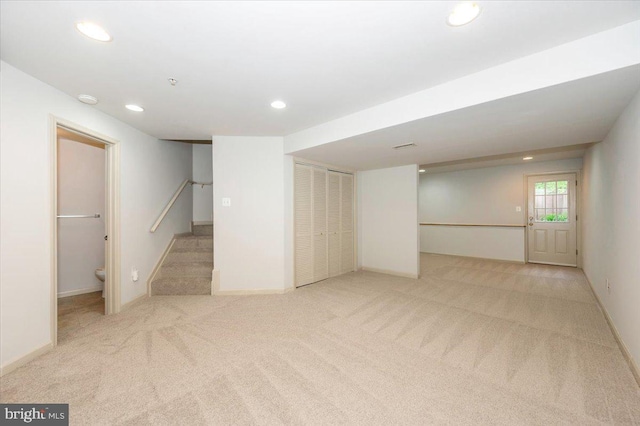 below grade area with recessed lighting, carpet, and baseboards