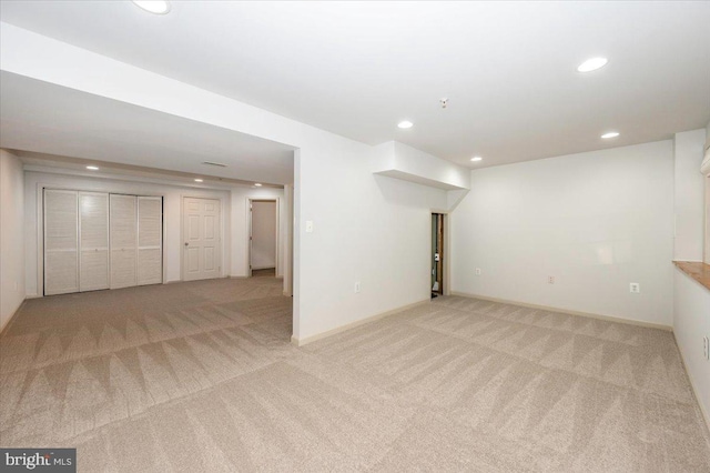 finished basement with carpet, recessed lighting, and baseboards