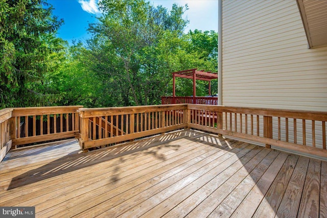 wooden terrace with a pergola