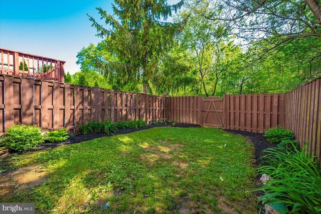view of yard with a gate
