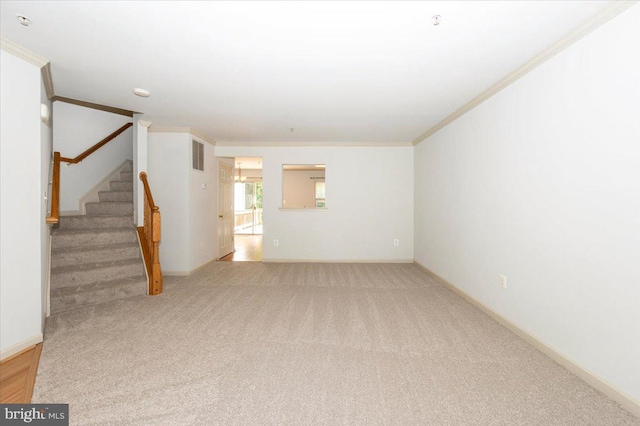 unfurnished living room featuring crown molding, light carpet, stairway, and baseboards