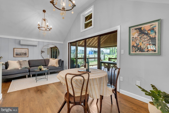 8014 Forest Glen Dr, Pasadena, MD 21122 - dining space featuring a wall mounted air conditioner, a chandelier, high vaulted ceiling, wood finished floors, and baseboards