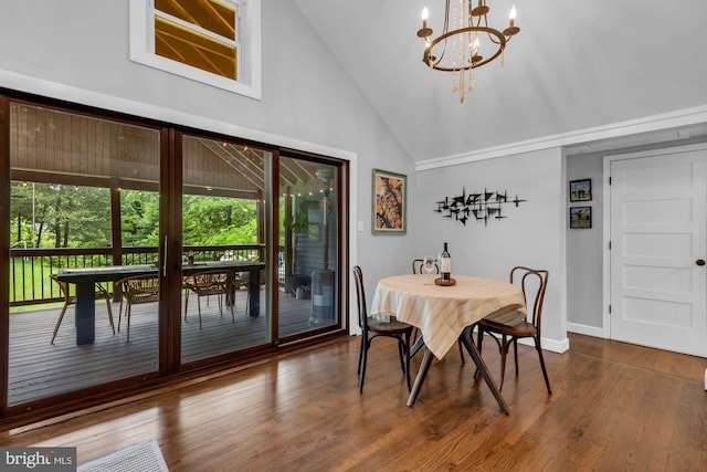 8014 Forest Glen Dr, Pasadena, MD 21122 - dining area with vaulted ceiling, a chandelier, dark wood finished floors, and baseboards