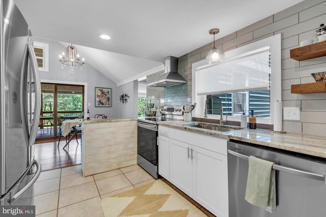 8014 Forest Glen Dr, Pasadena, MD 21122 - kitchen featuring wall chimney range hood, appliances with stainless steel finishes, a sink, vaulted ceiling, and a chandelier