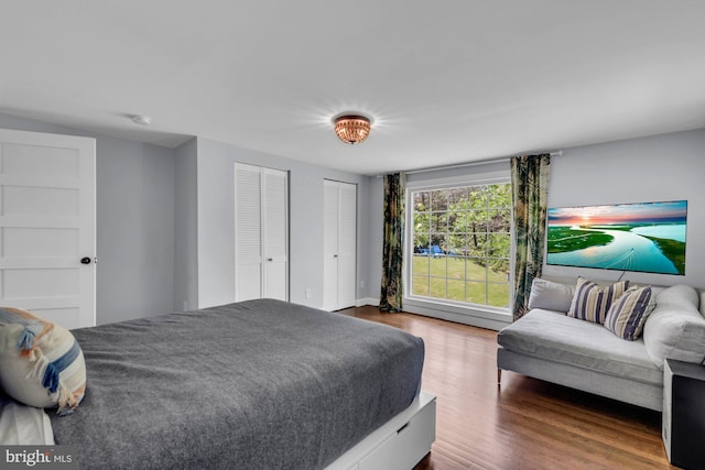 8014 Forest Glen Dr, Pasadena, MD 21122 - bedroom with wood finished floors and multiple closets