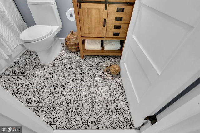 8014 Forest Glen Dr, Pasadena, MD 21122 - bathroom featuring toilet and tile patterned floors