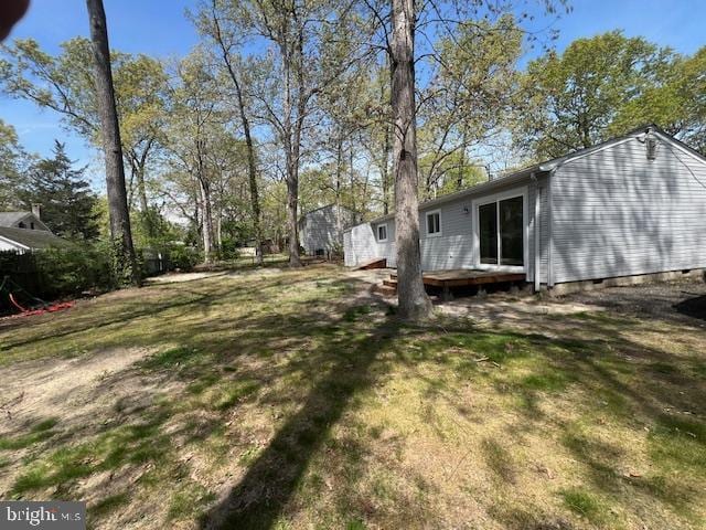 view of yard with a wooden deck