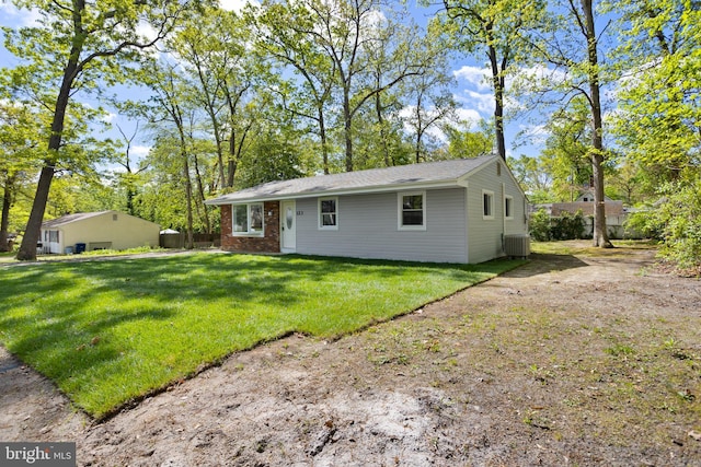 123 Pardee, Browns Mills, NJ 08015 - view of front of property featuring a front yard, central air condition unit, and brick siding