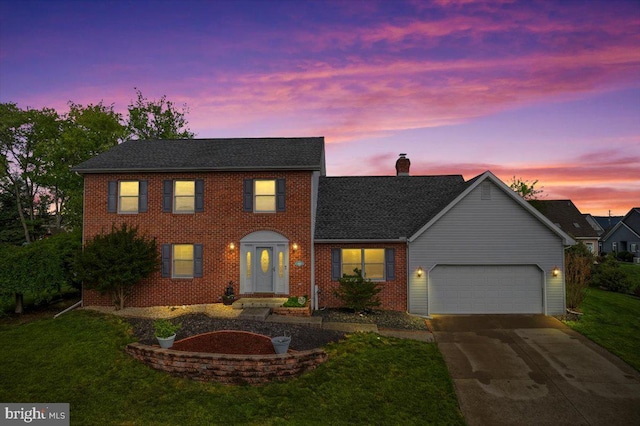 6122 Wallingford Way, Mechanicsburg, PA 17050 - colonial house with an attached garage, brick siding, concrete driveway, a chimney, and a lawn