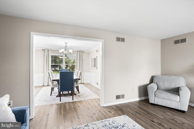 6122 Wallingford Way, Mechanicsburg, PA 17050 - living area with an inviting chandelier, visible vents, and wood finished floors