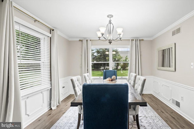 6122 Wallingford Way, Mechanicsburg, PA 17050 - dining space with a chandelier, visible vents, and wainscoting