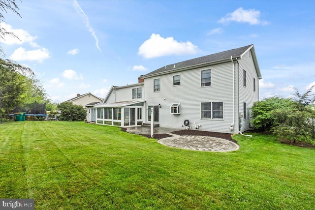 6122 Wallingford Way, Mechanicsburg, PA 17050 - back of property with a sunroom, a trampoline, a patio, and a lawn