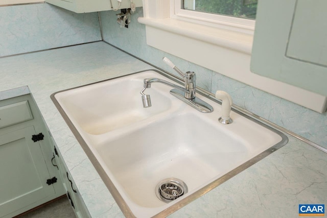 details featuring light countertops and a sink