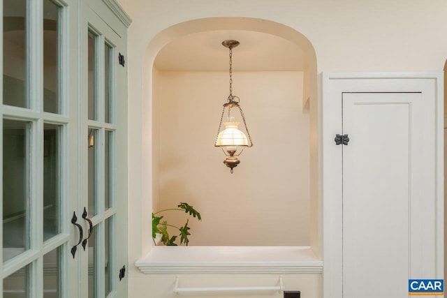 mudroom featuring arched walkways
