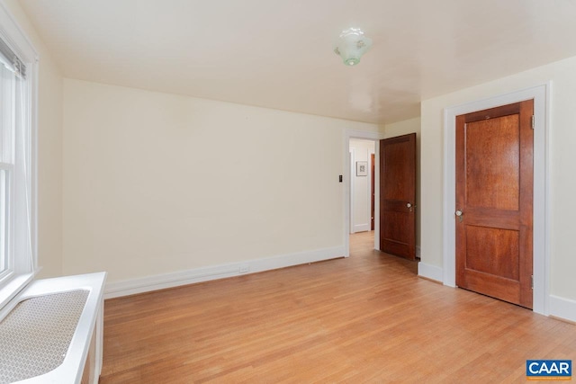 interior space with light wood-type flooring and baseboards