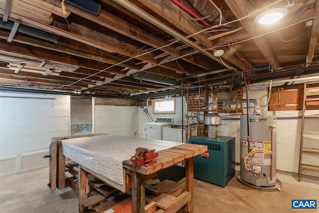basement featuring separate washer and dryer, a heating unit, and gas water heater