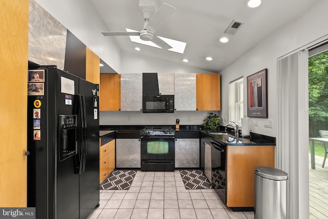 15708 Thompson Rd, Silver Spring, MD 20905 - kitchen featuring black appliances, a skylight, dark countertops, a sink, and a ceiling fan