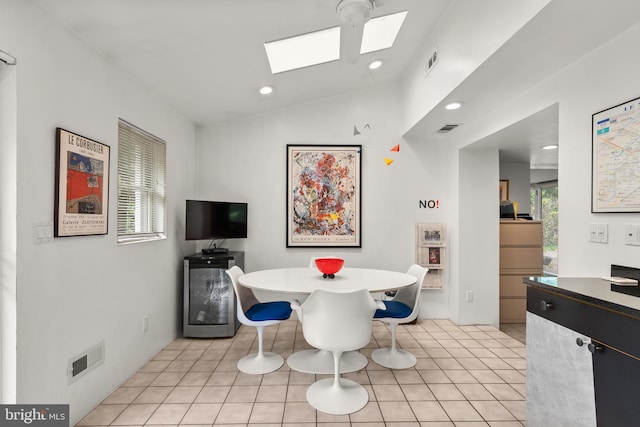 15708 Thompson Rd, Silver Spring, MD 20905 - dining room featuring a skylight, lofted ceiling, recessed lighting, and light tile patterned floors