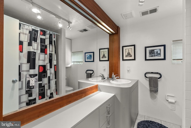 15708 Thompson Rd, Silver Spring, MD 20905 - full bathroom with toilet, tile patterned flooring, vanity, and a shower with shower curtain