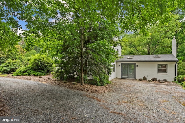 15708 Thompson Rd, Silver Spring, MD 20905 - view of front facade featuring a chimney and stucco siding
