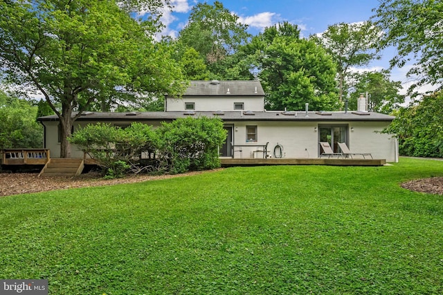 15708 Thompson Rd, Silver Spring, MD 20905 - back of house with a wooden deck, a yard, and stucco siding