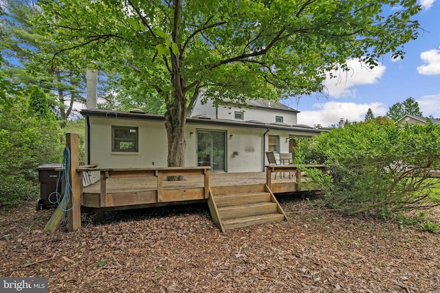 15708 Thompson Rd, Silver Spring, MD 20905 - back of property with a wooden deck and stucco siding