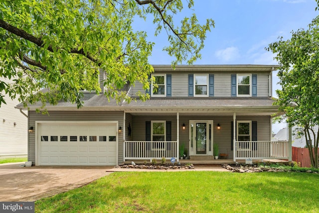 view of front of property featuring a porch, driveway, and an attached garage