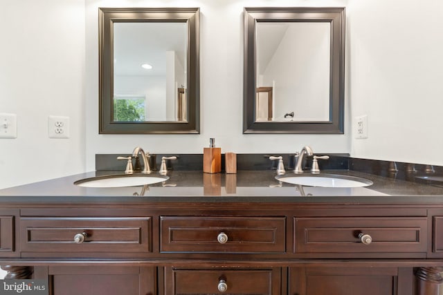 bathroom featuring double vanity