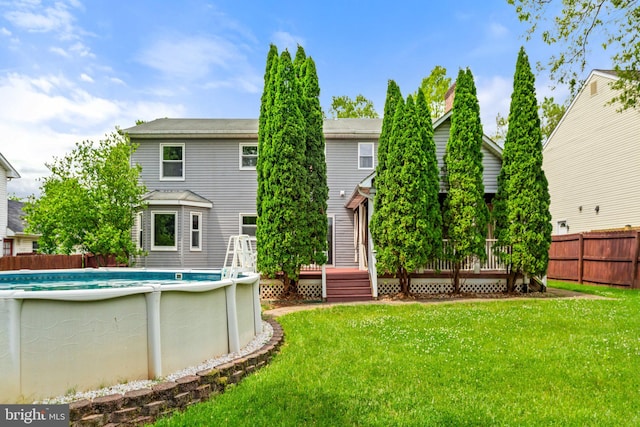 back of property with a wooden deck