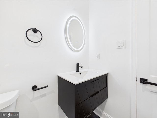 5135 N Fairhill St, Philadelphia, PA 19120 - half bath featuring vanity, toilet, and baseboards