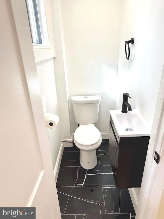 5135 N Fairhill St, Philadelphia, PA 19120 - bathroom with toilet, tile patterned floors, vanity, and baseboards