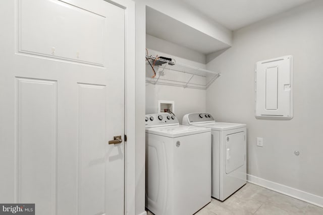 28010 Dew Drop Ln, Millville, DE 19967 - laundry room featuring laundry area, separate washer and dryer, baseboards, light tile patterned floors, and electric panel