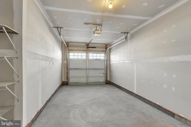 28010 Dew Drop Ln, Millville, DE 19967 - garage with baseboards and a garage door opener