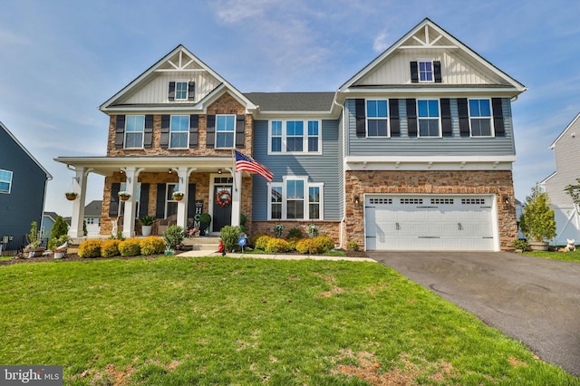 3911 Dewalt St, Bethlehem, PA 18020 - craftsman house with covered porch, a front yard, stone siding, board and batten siding, and driveway