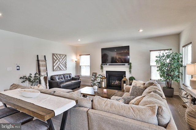 3911 Dewalt St, Bethlehem, PA 18020 - living area with recessed lighting, a glass covered fireplace, and dark wood-type flooring
