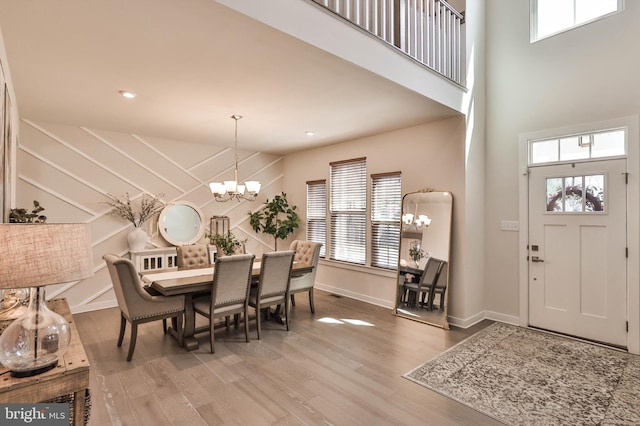 3911 Dewalt St, Bethlehem, PA 18020 - dining room with high vaulted ceiling, plenty of natural light, wood finished floors, and a chandelier