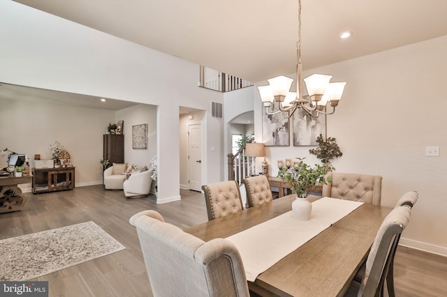 3911 Dewalt St, Bethlehem, PA 18020 - dining space with baseboards, visible vents, wood finished floors, and a chandelier