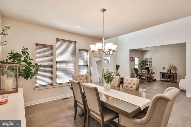 3911 Dewalt St, Bethlehem, PA 18020 - dining space featuring a notable chandelier, a wealth of natural light, and wood finished floors