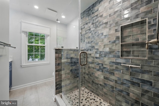 full bathroom featuring a stall shower, tile patterned flooring, recessed lighting, baseboards, and vanity