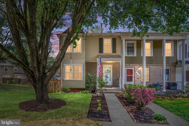 view of front of home with brick siding
