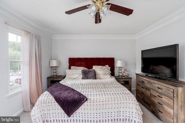 bedroom featuring crown molding, light colored carpet, baseboards, and ceiling fan