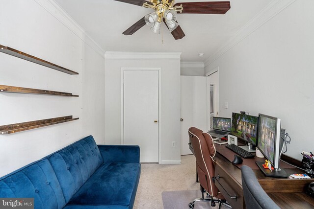 office area featuring ornamental molding, light carpet, and a ceiling fan
