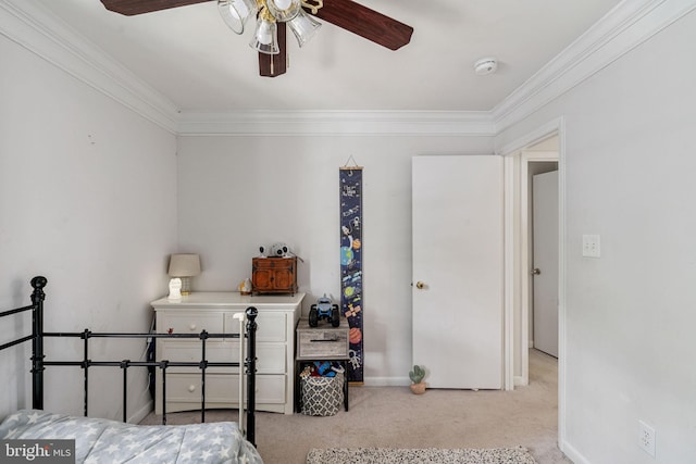 bedroom featuring crown molding, carpet flooring, baseboards, and ceiling fan