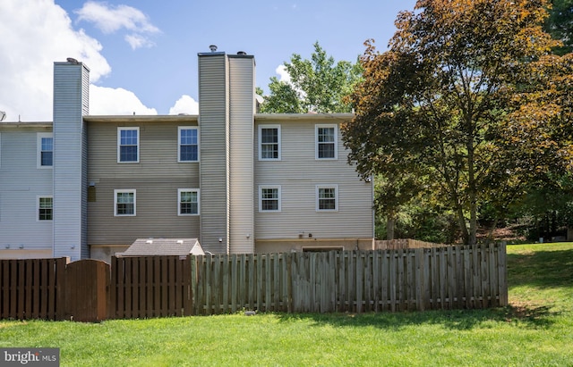 rear view of house featuring a chimney