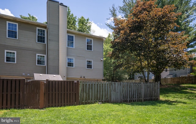 back of property featuring a chimney