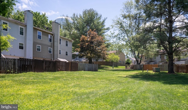 view of yard featuring central air condition unit