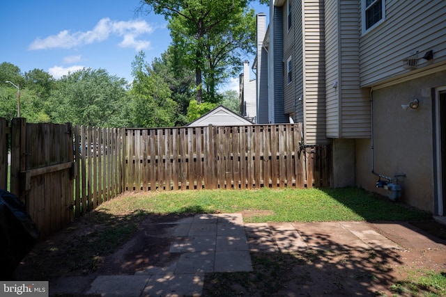 view of yard featuring a patio area and fence