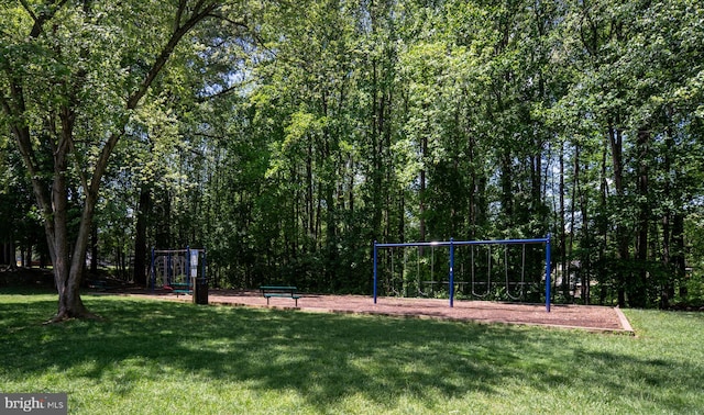 view of home's community with a yard