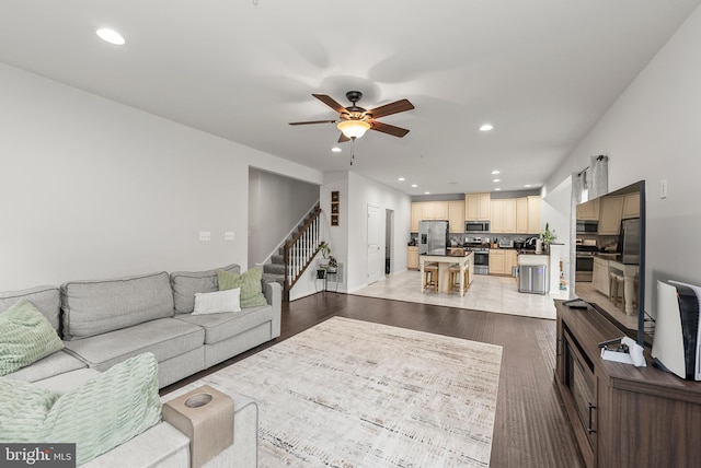 8365 Eagle St, Glen Burnie, MD 21060 - living area with ceiling fan, stairway, recessed lighting, light wood-style floors, and baseboards