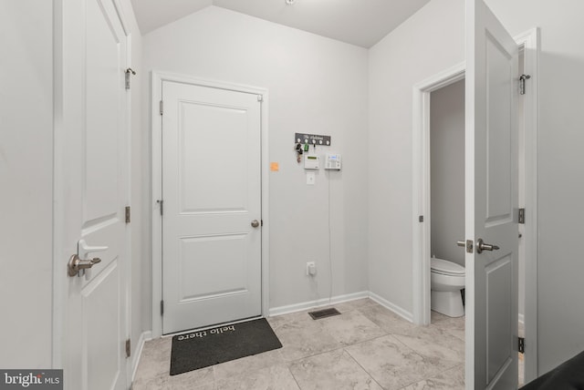 8365 Eagle St, Glen Burnie, MD 21060 - mudroom featuring baseboards and lofted ceiling